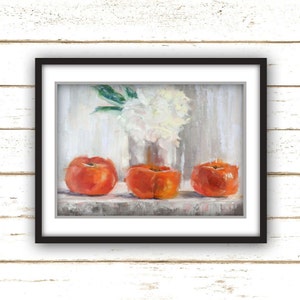 May include: A framed still life painting featuring three vibrant orange persimmons in the foreground. A vase of white flowers sits in the background. The artwork is set against a neutral, textured backdrop.