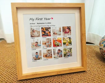 May include: A framed print titled "My First Year" with a series of 12 baby photos. The frame is light brown, and the print includes the name "Arthur" and the date "September 9, 2024". The photos are arranged in a grid.