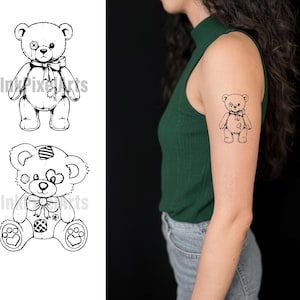 May include: Black and white illustrations of teddy bears. One bear has a patch over an eye and a bow tie. The other bear has a striped head and a bow tie. A tattoo of a teddy bear with a bow tie is on a person's arm.