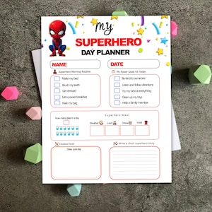 May include: A printable superhero day planner featuring a red and blue superhero illustration. The planner includes sections for a morning routine, power goals, a superhero meal, creative time, and a space to draw your day.