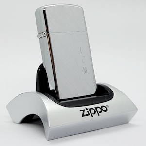 Isqueiro Zippo Slim Vintage 1973: Cromado de alto polimento, gravado em FCM, impecável na caixa