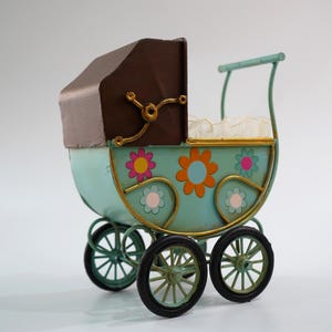 vintage style baby stroller figurine