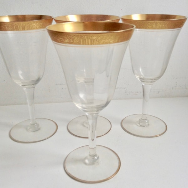 Four vintage Gold encrusted wine glasses.  Antique Crystal, etched stemware.