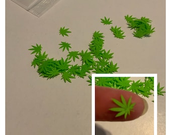 Green plastic marijuana confetti 50+ pieces