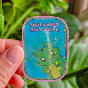 Sticker mignon "Chat Awkward but cute" | Sticker holographique | Illustration mignonne |