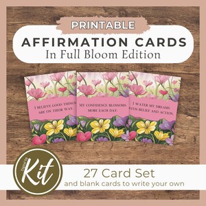 May include: Printable affirmation cards with floral designs and positive messages. The cards feature a pink, yellow, and purple floral pattern. The text on the cards reads: "I believe good things are on their way." "My confidence blossoms more each day." "I water my dreams with belief and action."