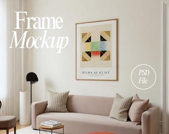 May include: A living room scene featuring a beige sofa with striped and solid pillows, a round coffee table, and an orange ottoman. A framed art print hangs above the sofa. The text "Frame Mockup" is visible.