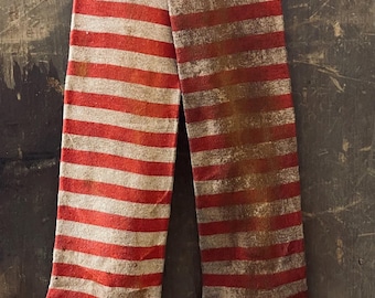 2 Primitive Grungy Stained  Christmas Red and White striped Stocking