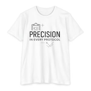 May include: White t-shirt featuring the text "PRECISION IN EVERY PROTOCOL" in black, accompanied by a clipboard icon and a tick symbol. The shirt is made of a soft, lightweight fabric.