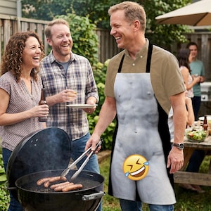 May include: A novelty apron featuring a realistic depiction of a male torso and legs. The apron has black straps and trim, and a laughing emoji covers the groin area. The scene includes a barbecue and people.