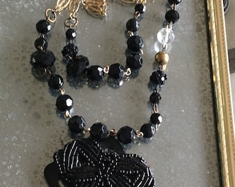 Black mourning modern fancy beaded bow pendant necklace with faceted jet black crystals and odd beads