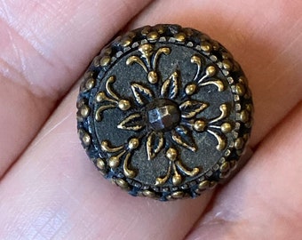 Ring - Antique Victorian / Edwardian era button with tinted back, stamped brass escutcheon and cut steel center - adjustable ring base