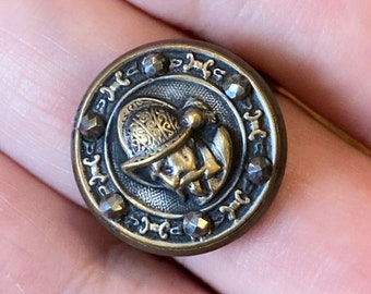 Ring - Antique Victorian era button repurposed into jewelry - stamped brass and cut steels - man w/ helmet - over 120 years old. Adjustable