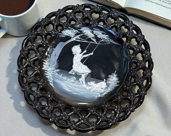 White enamel on Black Westmoreland Glass Plate with lattice border - great condition - Girl on Swing with her dog playing