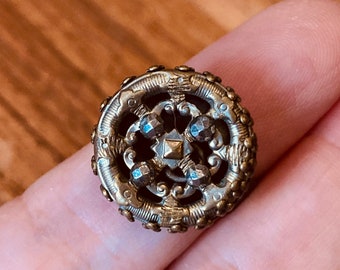 Ring - Antique Victorian /Edwardian era brass button repurposed into jewelry. Openwork brass design w/riveted cut steels - adjustable ring