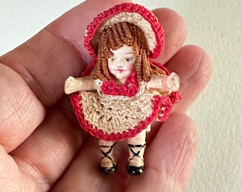 Antique / Vintage Sitting Miniature Doll with Shirley Temple ringlets & a red and white crocheted dress / hat  1-1/2" high