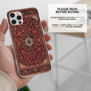May include: A clear phone case with a red, blue, and white patterned design that resembles a rug. The case is designed for an iPhone.