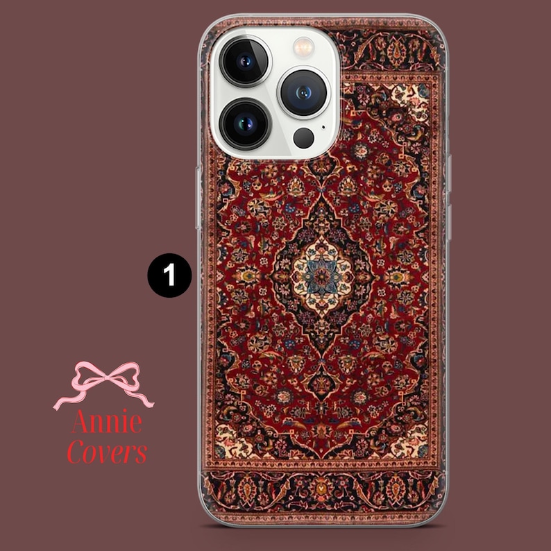 May include: A clear phone case with a red, blue, and yellow patterned design that resembles a rug. The case is designed for an iPhone with a camera bump.