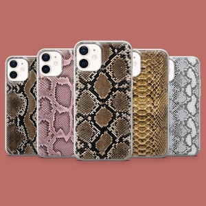 May include: Five different iPhone cases featuring a snake skin pattern. The cases are clear and showcase the pattern underneath. The patterns are brown and black, pink and white, brown and gold, and grey and white.