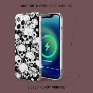 Puede incluir: Una funda de tel&eacute;fono en blanco y negro con un patr&oacute;n de calavera y lazo. La funda es compatible con la carga inal&aacute;mbrica y la pantalla del tel&eacute;fono muestra "75% cargado".