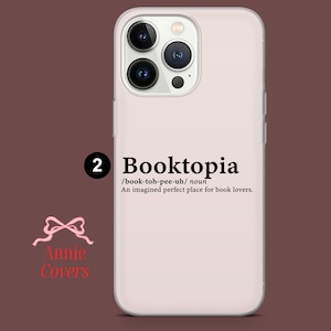 May include: White phone case with a black design that says "Booktopia /book-toh-pee-uh/ noun An imagined perfect place for book lovers."