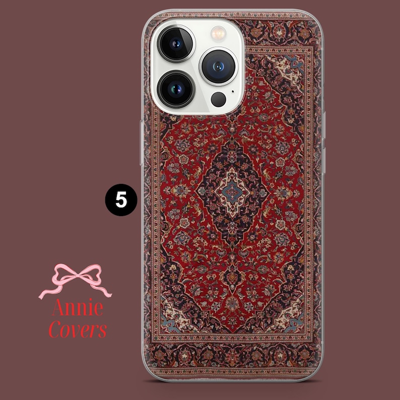 May include: A clear phone case with a red, blue, and white patterned design that resembles a Persian rug. The case is designed for an iPhone with a camera bump.