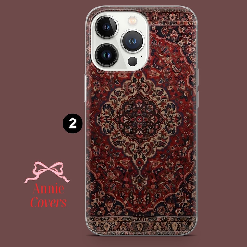 May include: A clear phone case with a red, black, and white patterned design that resembles a rug. The case is designed for an iPhone 13 Pro Max.