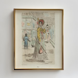 Peut inclure: Une illustration vintage d'une femme en robe jaune et verte avec un chapeau rouge et un parasol. La femme marche dans une rue d'une ville. L'illustration est encadrée d'or et porte le texte "Les Modes Feminines du Dix-Neuvieme Siecle" et "1830" en haut et en bas.