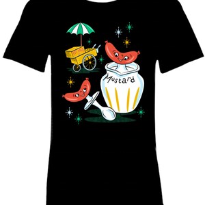 May include: A black t-shirt with a retro-style illustration of a hot dog cart, a mustard jar, and two smiling hot dogs. The mustard jar has the word "Mustard" written on it. The hot dog cart has a sign that says "Hot Dogs".