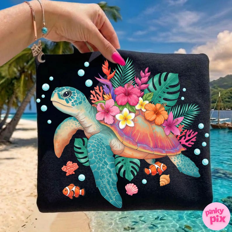 May include: Black tote bag featuring a colorful sea turtle design. The turtle has a blue head and flippers, with a shell in shades of orange and pink. The design includes tropical flowers, coral, and fish.