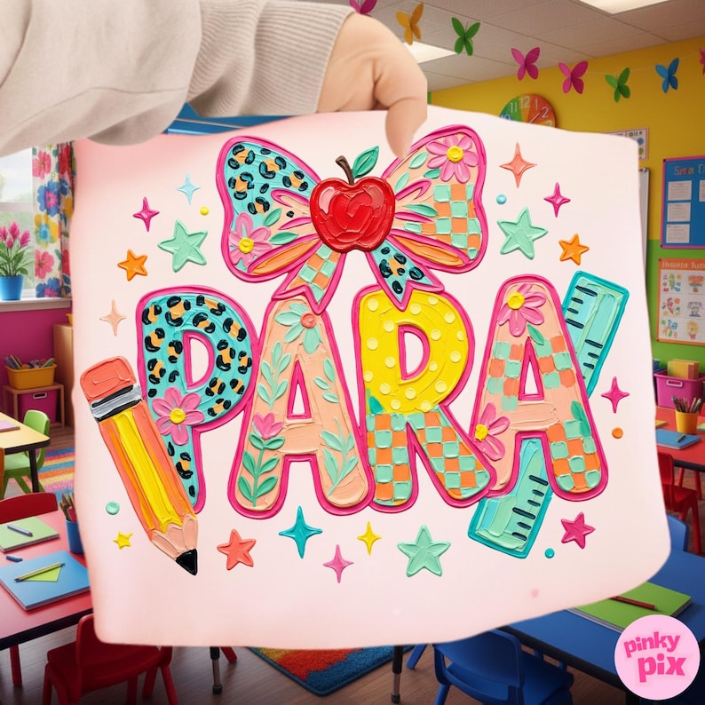 May include: A pink sign with the word "PARA" in colorful, textured letters. A large bow with a red apple sits above the letters. A pencil and stars decorate the sign, which is held up in a classroom setting.