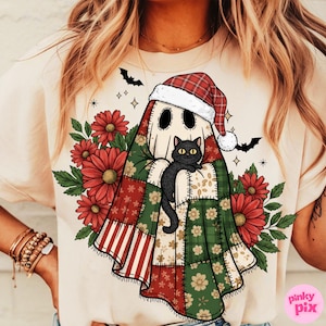 May include: Beige t-shirt featuring a whimsical ghost design. The ghost wears a Santa hat and is draped in a patchwork quilt, holding a black cat. Red flowers and green leaves surround the ghost, with bats and stars in the background.