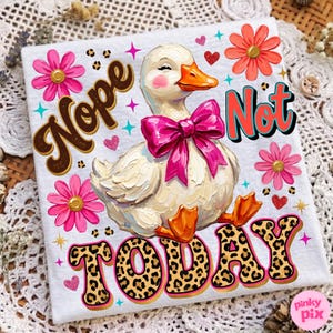 May include: A white t-shirt featuring a cartoon duck with a pink bow, surrounded by pink and orange flowers, hearts, and the words "Nope Not Today" in a playful font. The word "Today" has a leopard print design.