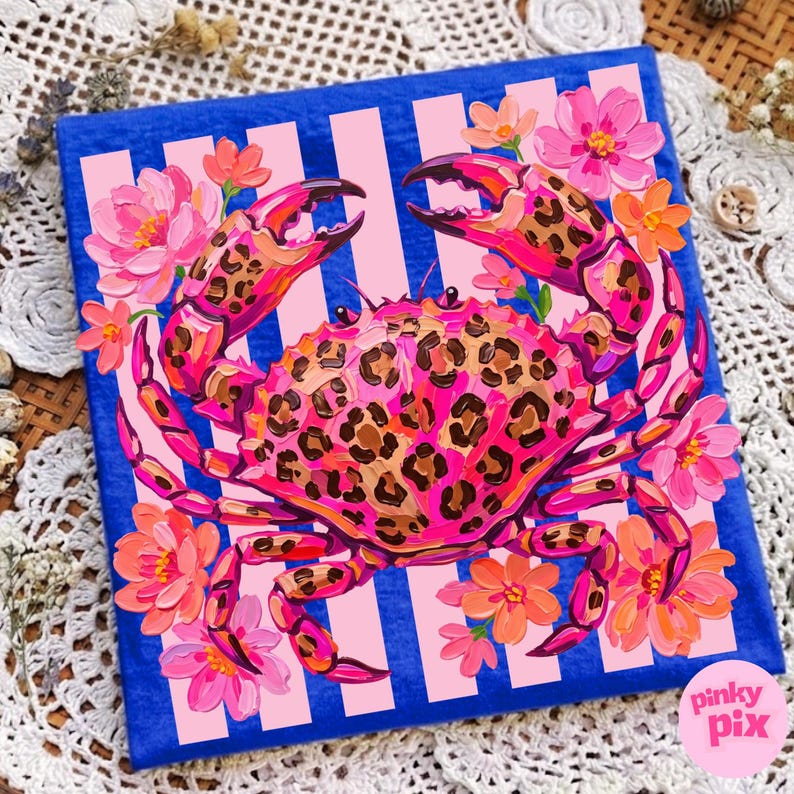May include: A vibrant painting of a crab with a leopard print design on a blue background with pink stripes. The crab is surrounded by pink and orange flowers. The artwork has the text "pinky pix" in the bottom right corner.