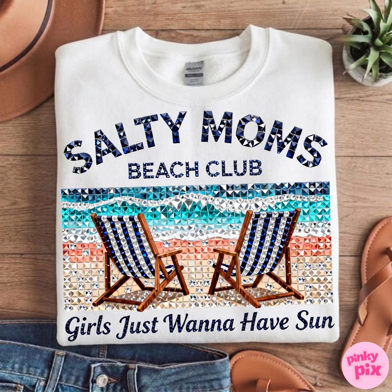 May include: White sweatshirt with the text "SALTY MOMS BEACH CLUB" in blue mosaic lettering. Below the text is a beach scene with two blue and white striped beach chairs. The phrase "Girls Just Wanna Have Sun" is printed at the bottom.