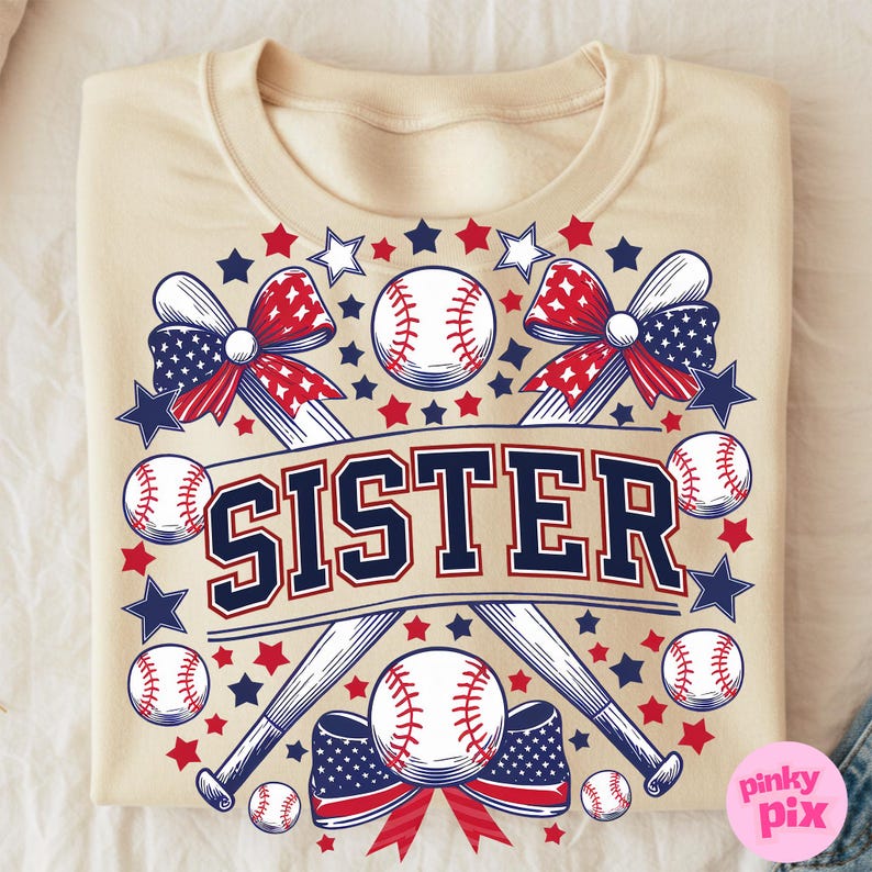 May include: A beige t-shirt with a graphic design featuring two crossed baseball bats, baseballs, red, white, and blue bows, and the word "SISTER" in navy blue letters.