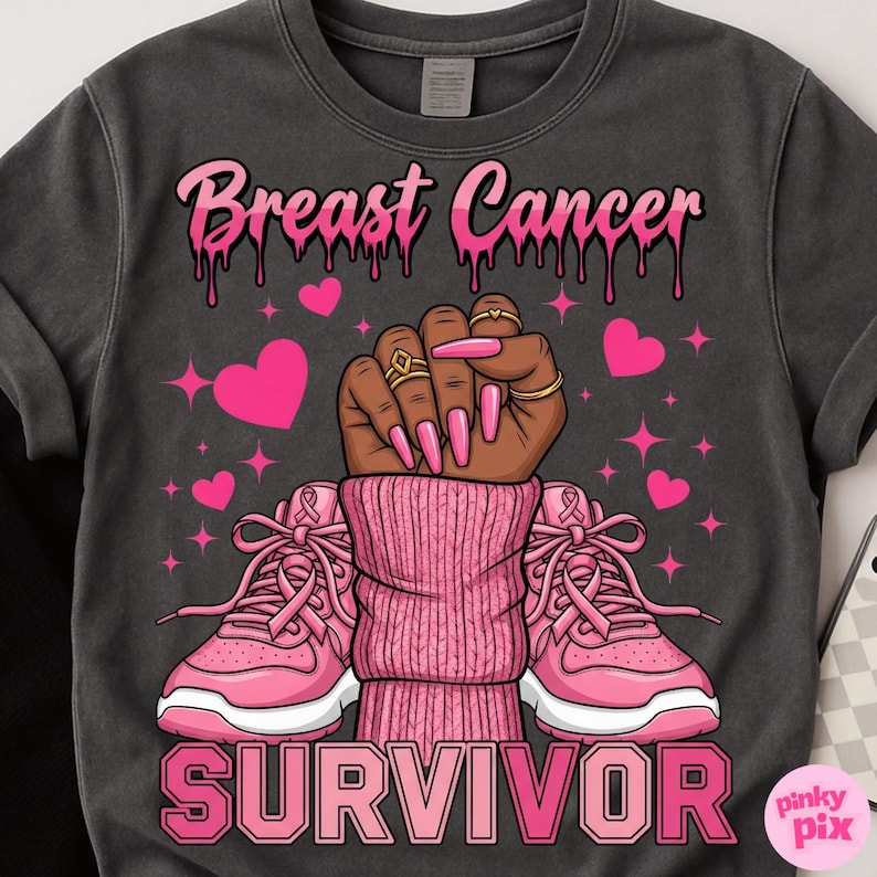 May include: Dark gray t-shirt with a pink graphic supporting breast cancer awareness. The design includes the words "Breast Cancer" and "Survivor", a raised fist, pink hearts, and pink sneakers.