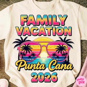 May include: Cream-colored t-shirt with a colorful graphic design. The design features the words "FAMILY VACATION" above "Punta Cana 2026". Sunglasses with palm trees and a sunset are in the center. The shirt is a casual wear item.