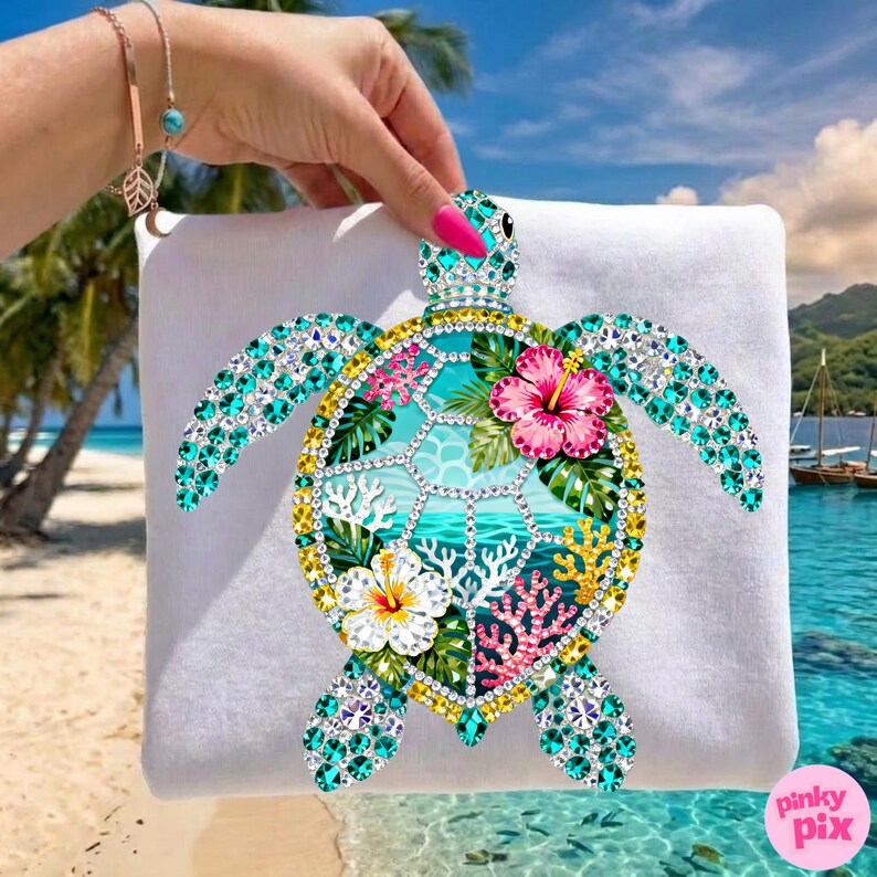 May include: A white square pillow featuring a colorful bejeweled sea turtle design. The turtle has turquoise gems on its flippers and head, with a yellow and gold outline. The turtle's shell has a tropical scene with flowers and coral.