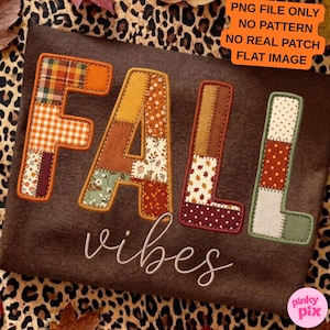May include: A brown fabric background featuring the word FALL in large, block-style letters with a patchwork design of various autumn-themed patterns and colours. Below, the word vibes is written in a white, cursive script font.