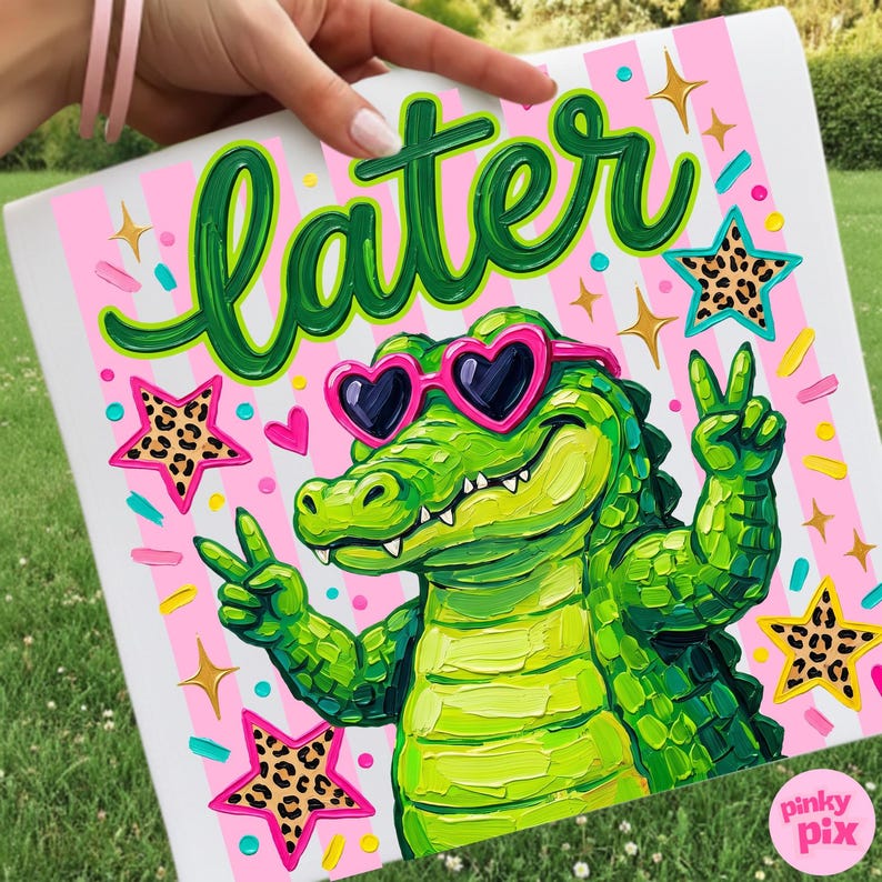 May include: A colorful artwork featuring a green alligator wearing heart-shaped sunglasses and giving a peace sign. The word "later" is written in green script above the alligator. Pink and white stripes form the background, with star and heart accents.