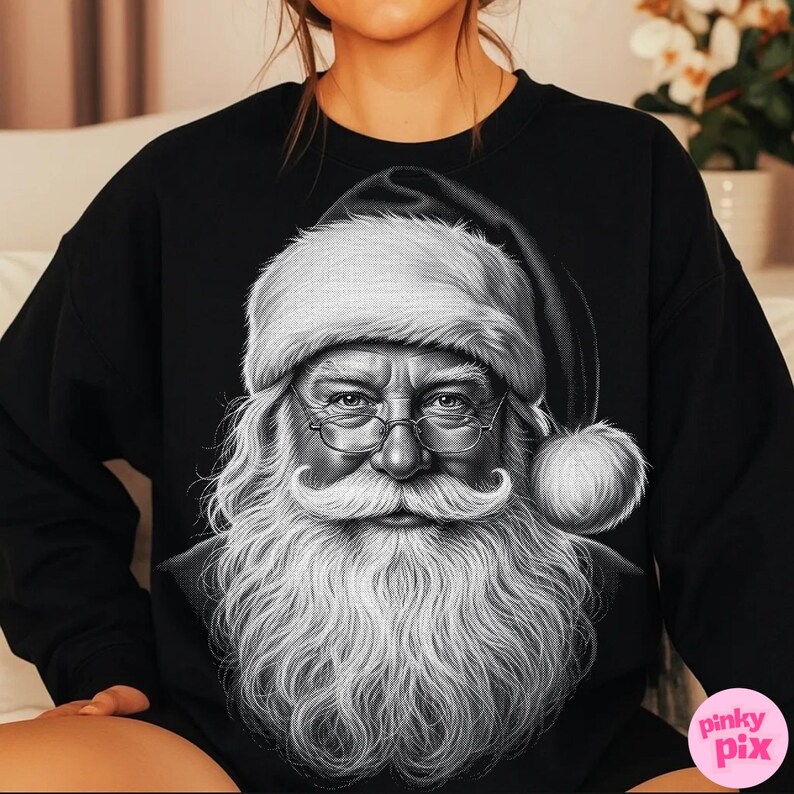 May include: Black sweatshirt featuring a detailed black and white illustration of Santa Claus. The image shows Santa with a long white beard, glasses, and a traditional hat. The design is centered on the front of the sweatshirt.