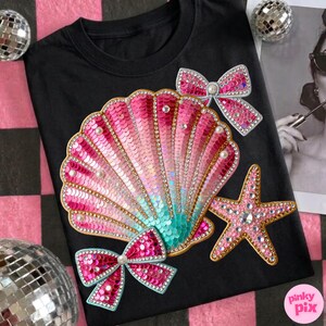 May include: Black t-shirt featuring a sequined seashell design in pink, gold, and teal, adorned with pearls and rhinestones. Includes a pink starfish and two pink sequined bows. A fun, eye-catching design.