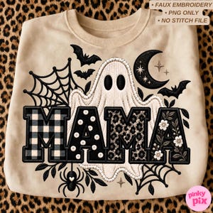 May include: A beige sweatshirt featuring a graphic with the word MAMA in large block letters. The letters have plaid, polka dot, leopard, and floral patterns. A white ghost, black spider, spiderwebs, bats, and a crescent moon surround the text.