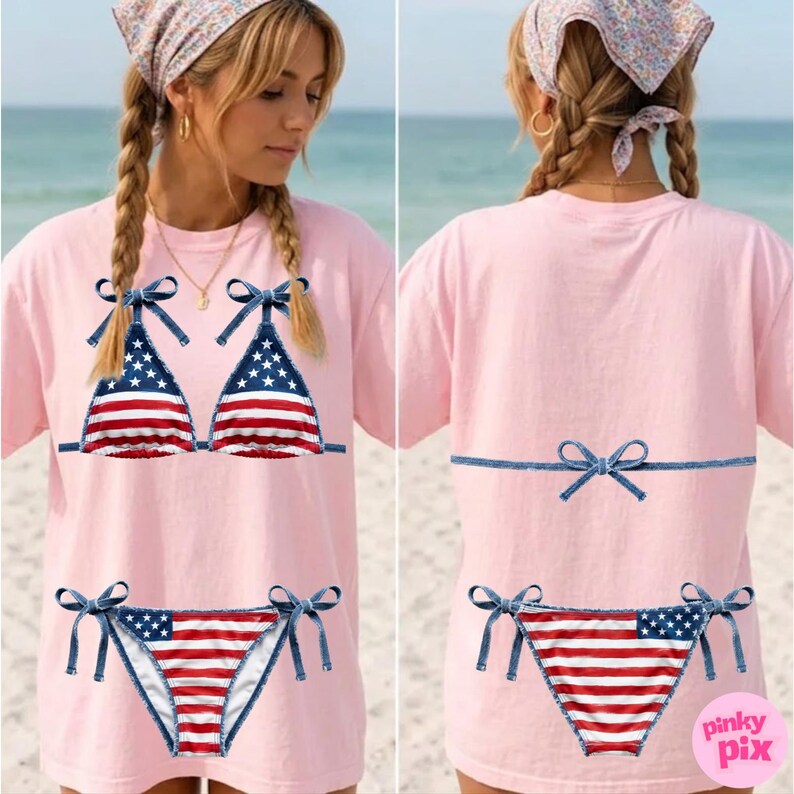 May include: A light pink t-shirt with a graphic of a bikini in the style of the American flag. The bikini top and bottom are detailed with blue denim-style bows. The back of the shirt also has a bow design.