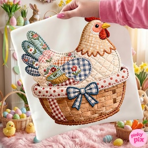 May include: A decorative cushion featuring a patchwork chicken in a woven basket. The chicken has a red comb and yellow beak. The basket has a blue bow. The cushion is held by a person.