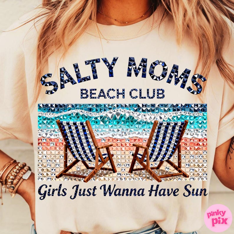 May include: A light beige t-shirt with the text "SALTY MOMS BEACH CLUB" in blue. Below the text is a beach scene with two blue and white striped beach chairs. The text "Girls Just Wanna Have Sun" is below the beach scene.