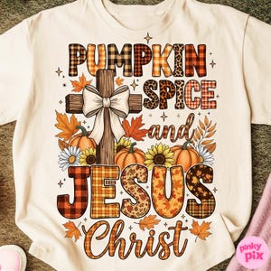 May include: Cream-colored t-shirt with a fall-themed graphic. The design features a wooden cross with a white bow, pumpkins, sunflowers, and the words "PUMPKIN SPICE and JESUS Christ" in various patterned fonts. Autumn leaves and stars complete the design.