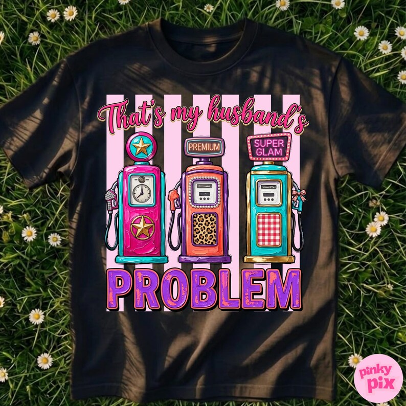 May include: Black t-shirt with a graphic of three vintage gas pumps in pink, orange, and teal, with the text "That's my husband's PROBLEM" in pink and purple. The pumps have star and leopard print details.