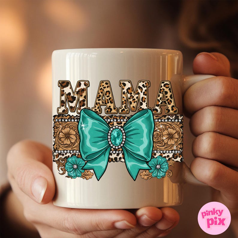 May include: White ceramic coffee mug with a brown and black leopard print design that says "MAMA" in large letters. The mug also features a turquoise bow with a rhinestone in the center and a brown and black floral design.